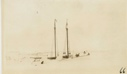 Image of Bowdoin in winter quarters with Wiscasset flag